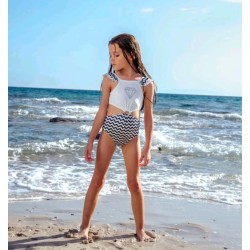 Детски цял бански в бяло и тъмносиньо с изрязани детайли  Диамант