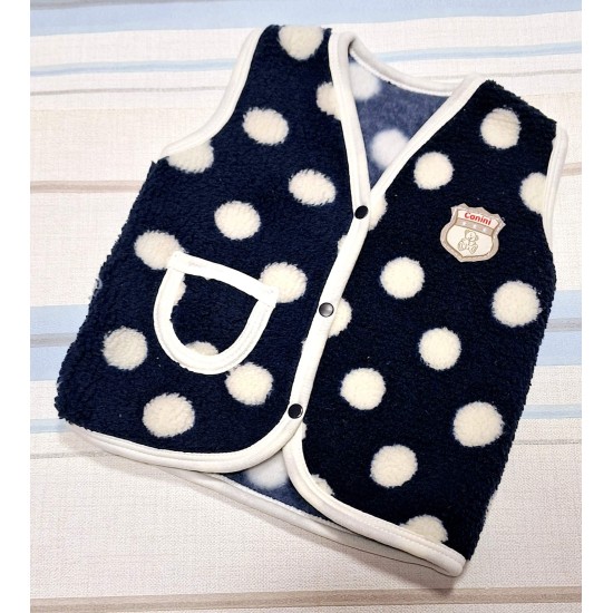 Бебешки пухкав елек в тъмносиньо на бели точки